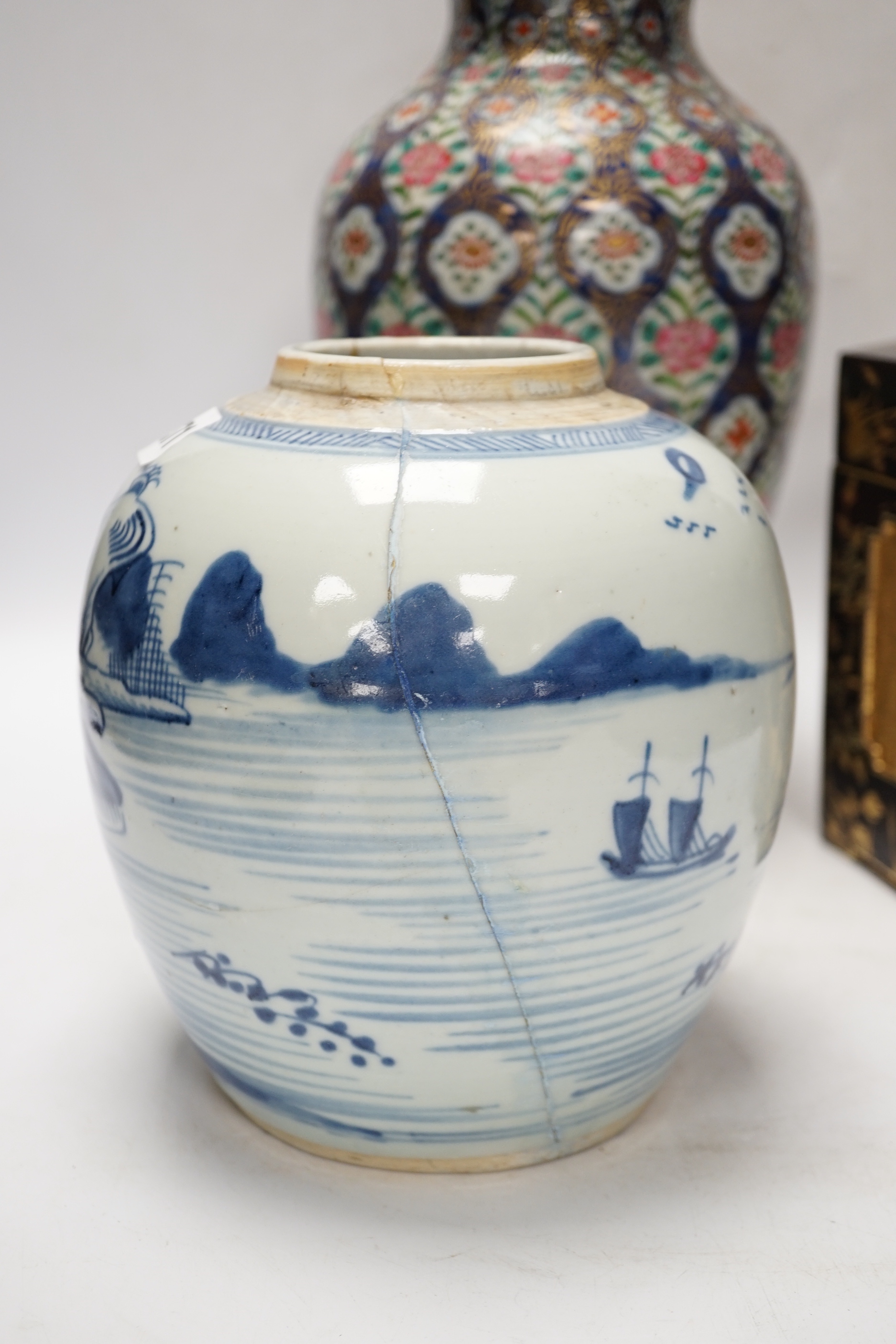 A group of Chinese items including a hardwood carving of luohan, an 18th century blue and white jar, a lacquer box, etc.